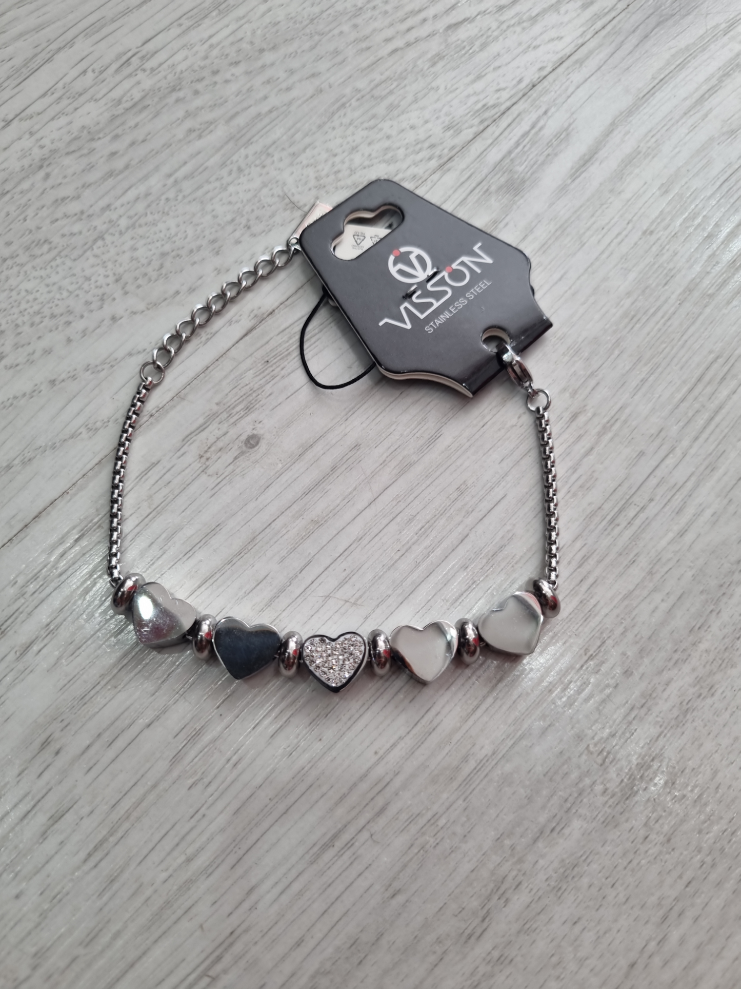 Bracciale in acciaio con cuori bombati e strass